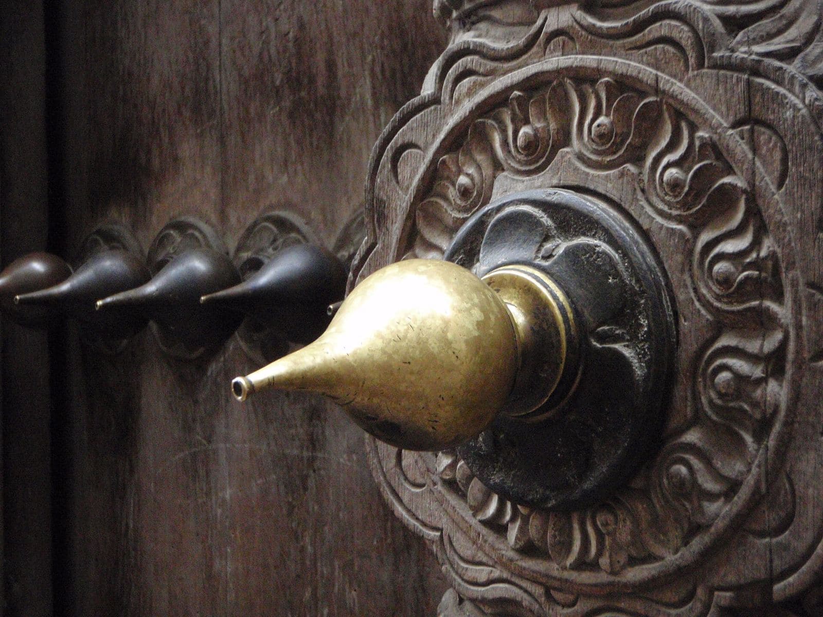 A carved Zanzibar door with brass studs